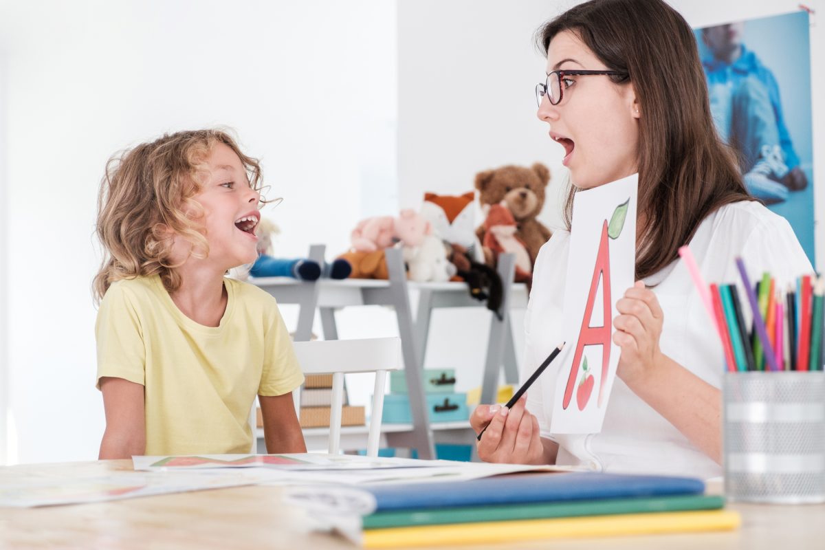 A Speech Therapist Helping A Child